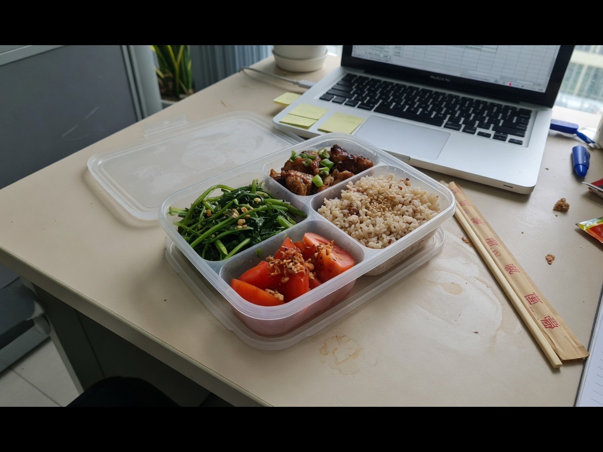 Lunch box with chicken, egg, and vegetables